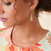 Featuring delicate starfish accents adorned with shimmering details, these elegant earrings capture the beauty of the ocean while adding a playful sparkle to any outfit.