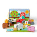 A colorful wooden toy set featuring various farm animals, including cows, pigs, and chickens, arranged on a play surface.