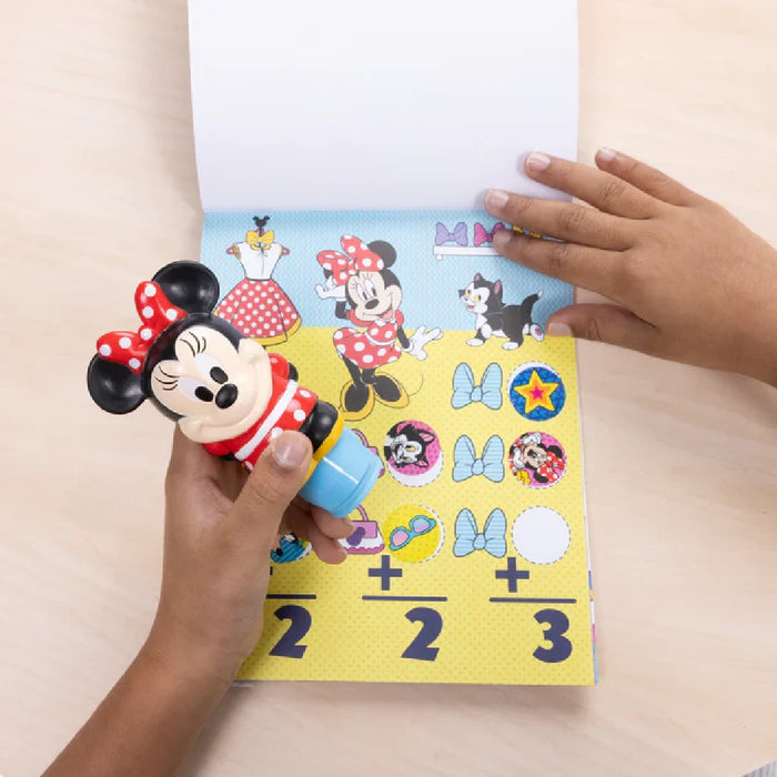 A Minnie Mouse-themed sticker book paired with a playful toy, ideal for creative activities.
