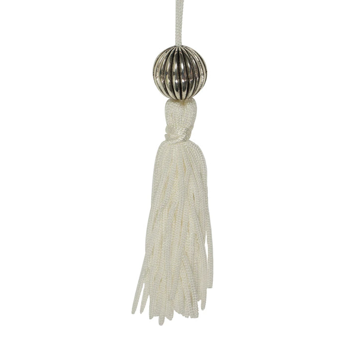A stylish book tag adorned with a tassel and a white ribbon, perfect for personalizing or gifting books.
