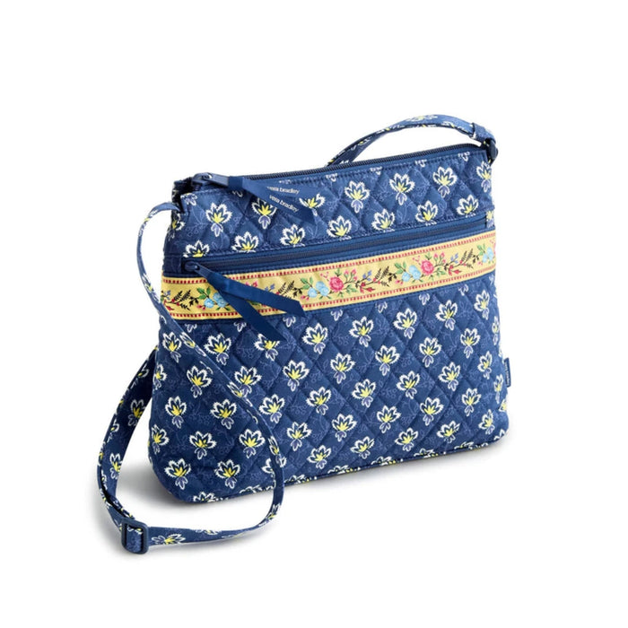  Blue floral print crossbody bag made from soft fabric, featuring a stylish and functional design for everyday use.