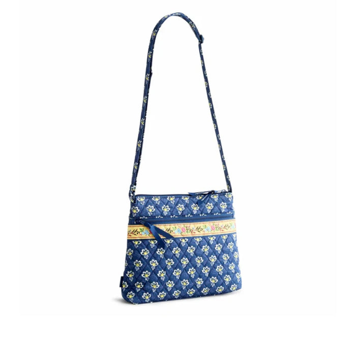 Soft fabric crossbody bag with a blue floral print, ideal for adding a touch of style to any outfit.