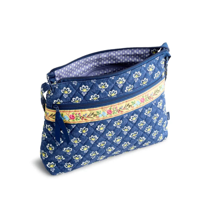 A vibrant blue and yellow floral pattern featuring various flowers against a contrasting background.