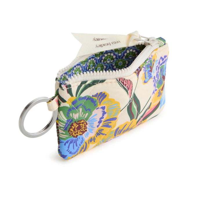 A compact purse featuring a lanyard for convenient wear and hands-free use.