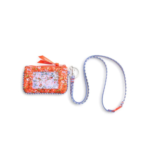 A small purse featuring a blue strap adorned with vibrant orange flowers.