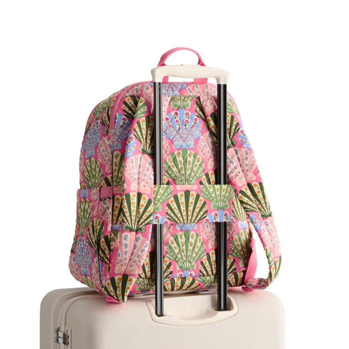 A pink backpack featuring a vibrant green and pink pattern, designed for style and functionality.
