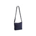 Navy blue quilted bag featuring a zipper closure.
