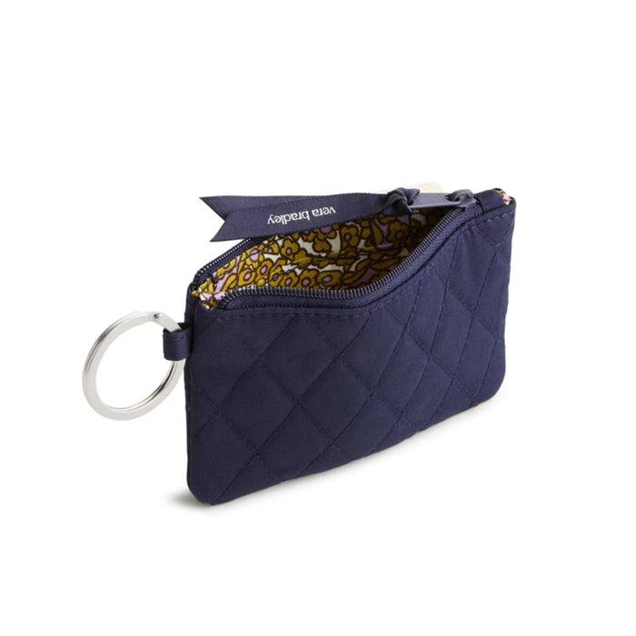 A compact purse featuring a key chain, ideal for holding small items and keys together.  
