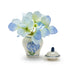 A decorative blue and white vase showcasing a bouquet of blue flowers, adding a touch of color to the setting.