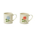 Two ceramic mugs adorned with colorful floral patterns, placed side by side on a wooden surface.