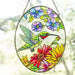 This handcrafted stained glass suncatcher features a stunning hummingbird design in rich, jewel-toned art glass.