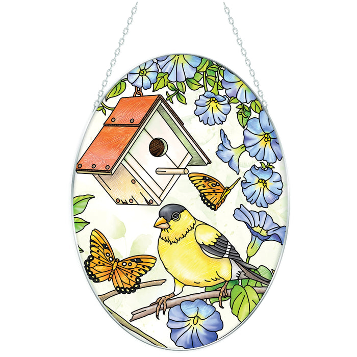 7-inch stained-glass-style Birdsong Goldfinch suncatcher with vibrant yellow and black details hanging in a sunny window.