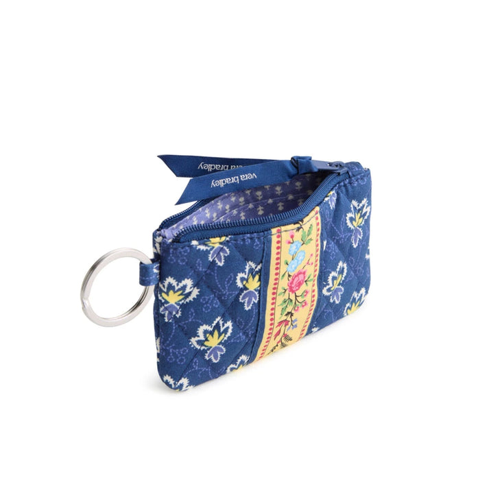 A blue handbag adorned with a floral pattern, combining elegance with a touch of nature.