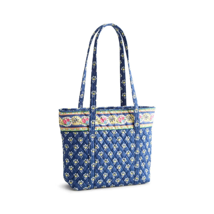 A stylish tote bag featuring a blue and white floral pattern, perfect for carrying essentials with elegance.
