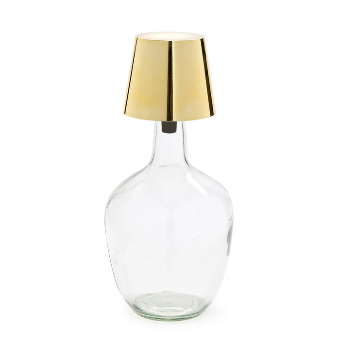 Clear glass bottle with a gold metallic  LED Lamp cap on a white background