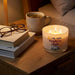 The Pavilion Gift Co Late Night Tranquility 11 oz Soy Wax Candle fills your space with a soft, soothing fragrance that melts away the stress of the day.