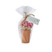 Two decorative flower pots filled with various sticks of flowers, adding a touch of nature to the setting.