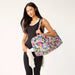 Designed for the modern explorer, this spacious duffel offers ample storage space coupled with stylish details