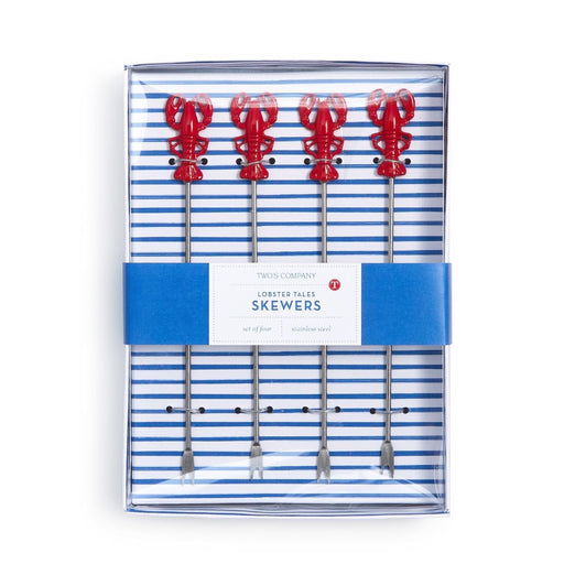Lobster skewers arranged neatly in a takeout box, showcasing their vibrant color and appetizing presentation.