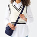 Vera Bradley Tasha Triple Compartment Crossbody bag in Peacoat navy with multiple compartments and adjustable strap.