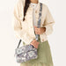 Vera Bradley Tasha Triple Compartment Crossbody in Neutral Rhapsody pattern with multiple compartments and adjustable strap.