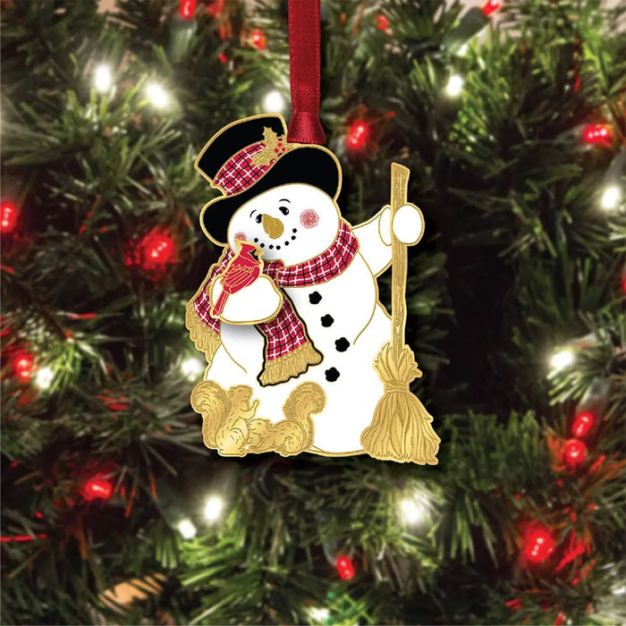 Decorative snowman ornament with a top hat and broom on a Christmas tree.