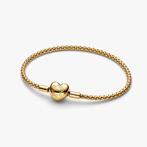 Gold-tone woven mesh chain bracelet with a polished heart-shaped clasp displayed on a white background, perfect for charms and everyday wear.