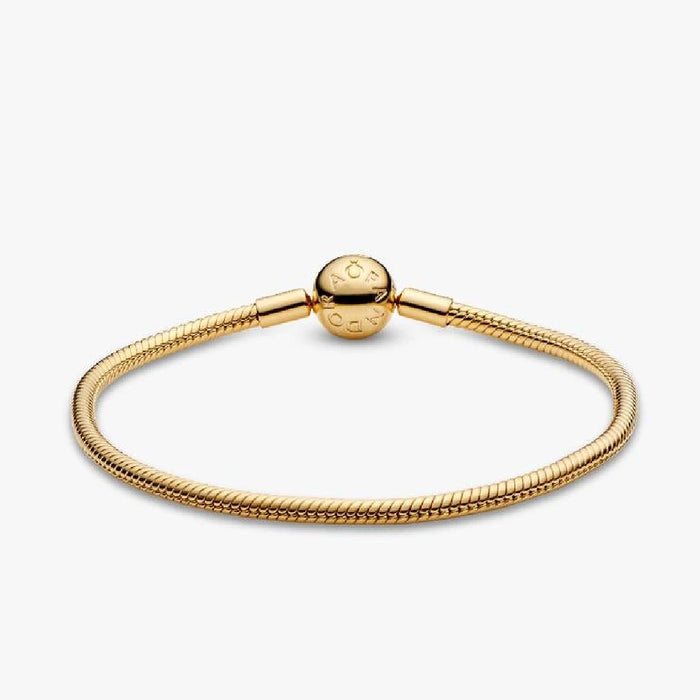Elegant gold-plated bracelet adorned with a small ball detail.