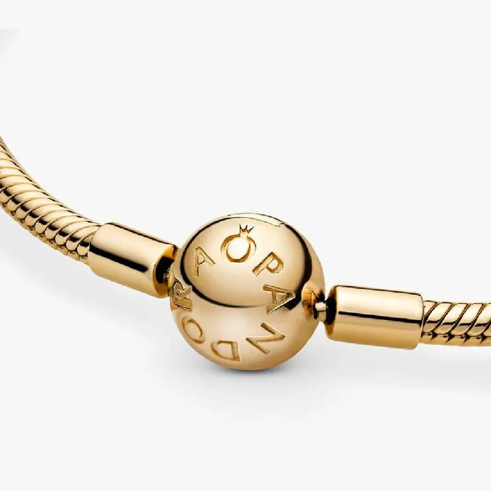 Gold-plated bracelet showcasing a small spherical ornament.