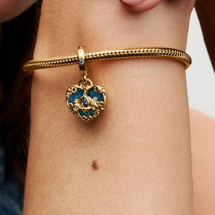 A woman adorned with a gold bracelet and a matching gold necklace, showcasing elegant jewelry.