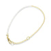 A delicate gold chain adorned with a lustrous pearl clasp, highlighting refined jewelry design.