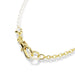 A stylish gold chain with a pearl clasp, combining classic elegance with modern aesthetics.