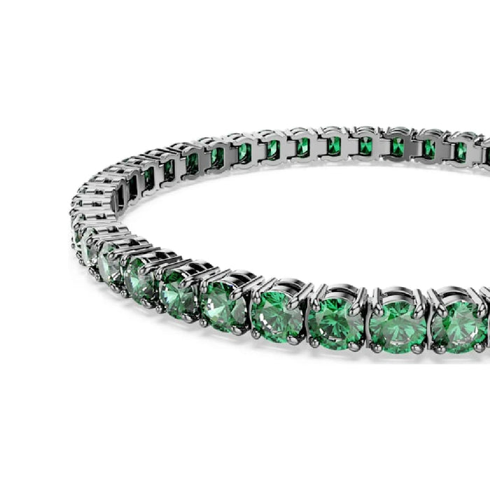 An elegant tennis bracelet featuring a series of sparkling emerald stones, perfect for special occasions.