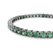 An elegant tennis bracelet featuring a series of sparkling emerald stones, perfect for special occasions.
