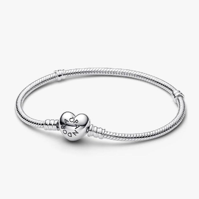 A silver bracelet featuring a heart charm, elegantly designed for a stylish accessory.