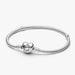 A silver bracelet featuring a heart charm, elegantly designed for a stylish accessory.