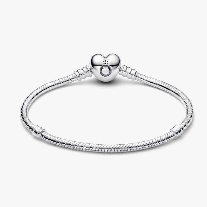 A delicate silver bracelet adorned with a charming heart pendant, perfect for any occasion.