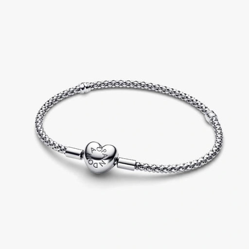 Sterling silver mesh chain bracelet with a polished heart-shaped clasp designed for everyday wear and compatible with charm beads.
