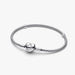 Sterling silver mesh chain bracelet with a polished heart-shaped clasp designed for everyday wear and compatible with charm beads.