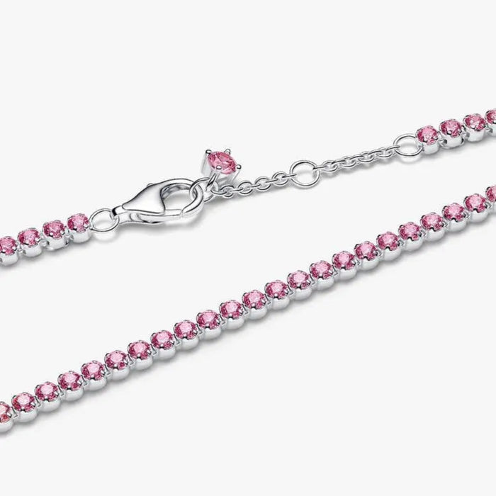 Pandora Pink Small Tennis Bracelet in sterling silver with pink cubic zirconia displayed on a white background.