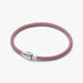 Pink cord bracelet with sterling silver clasp worn on the wrist
