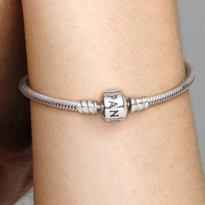 Pandora Moments Barrel Clasp Snake Chain Bracelet featuring a polished snake chain with a classic barrel clasp, designed for Pandora Moments charms and accessories.