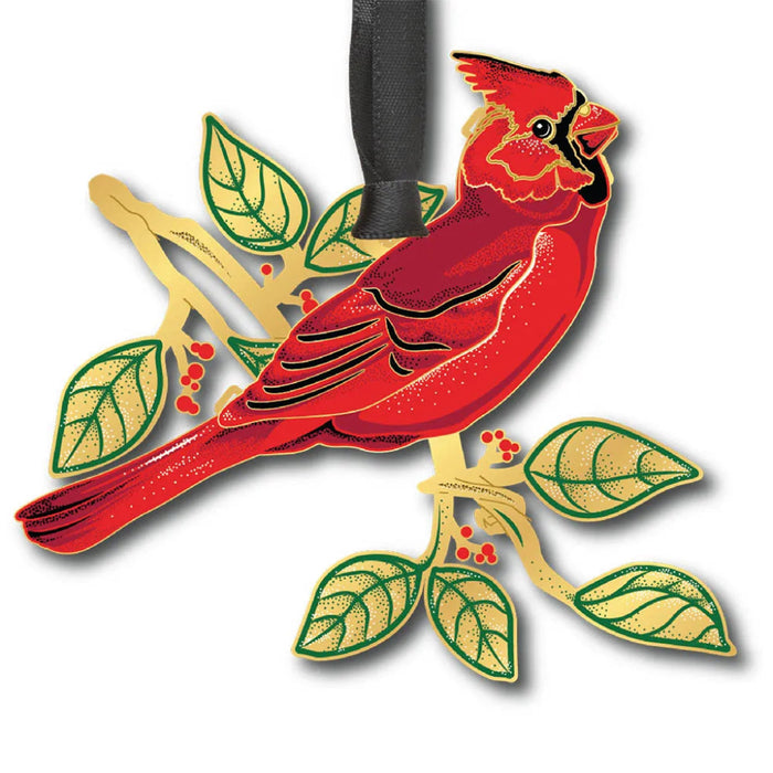 Red cardinal bird ornament with green leaves on a white background