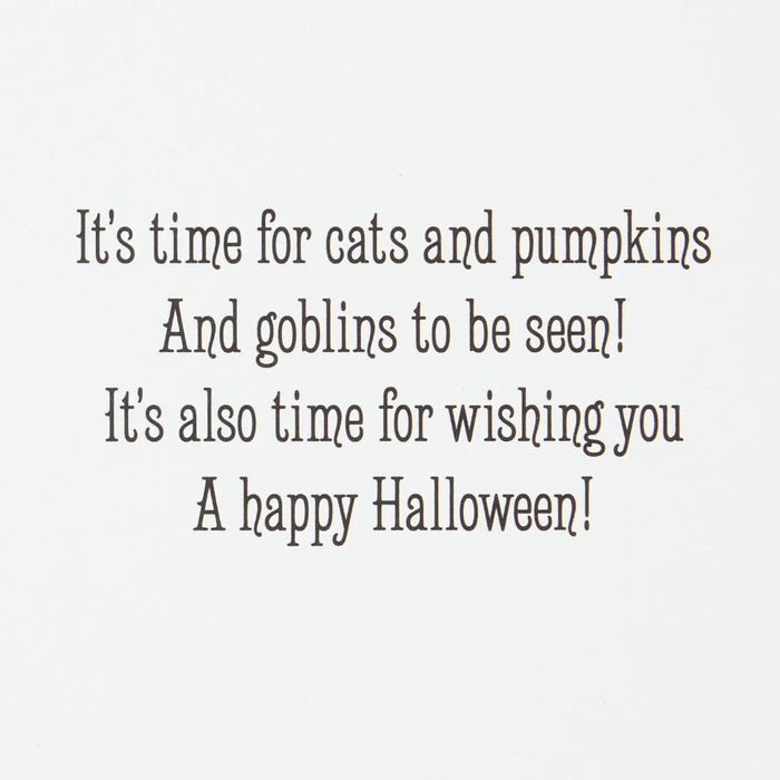 Hallmark vintage Halloween greeting card featuring a charming young witch, black cat, glowing pumpkin, and sparkling foil accents.