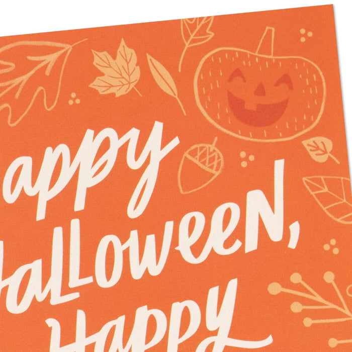 Front of Hallmark Halloween card featuring jack-o'-lanterns, pumpkins, fall leaves, and gourds on an orange background