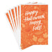 Front of Hallmark Halloween card featuring jack-o'-lanterns, pumpkins, fall leaves, and gourds on an orange background