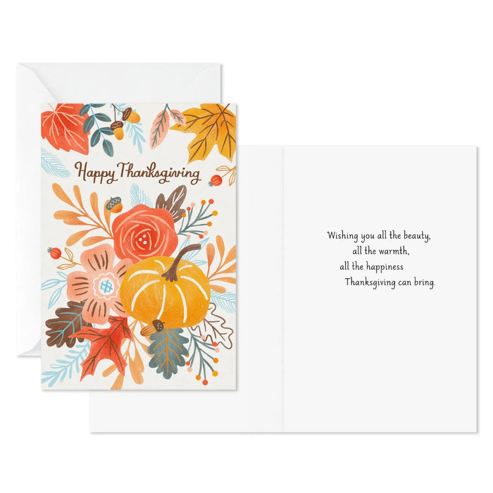 Thanksgiving greeting card featuring a harvest pumpkin, colorful autumn leaves, and floral accents for seasonal celebrations.