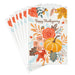 Thanksgiving greeting card featuring a harvest pumpkin, colorful autumn leaves, and floral accents for seasonal celebrations.