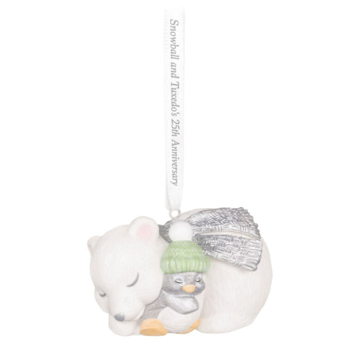Decorative Holiday ornament with a polar bear and penguin snuggling on a white background. 