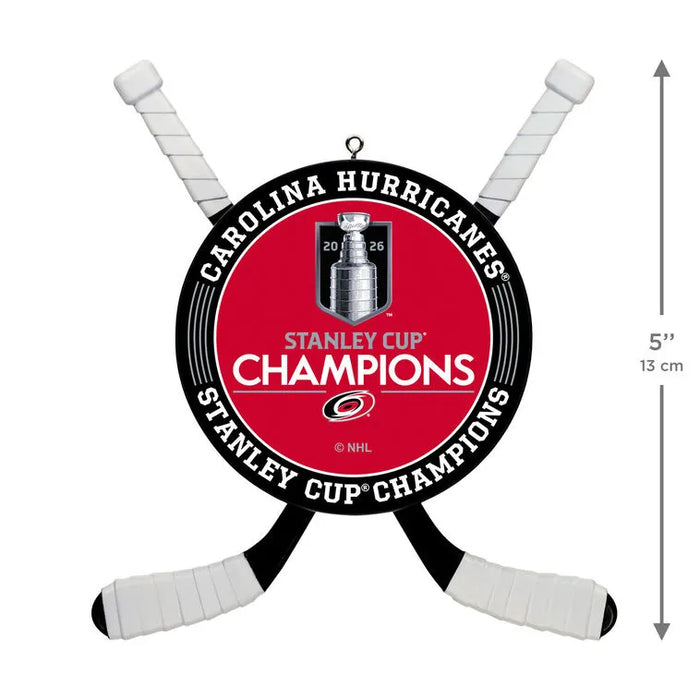 Carolina Hurricanes Stanley Cup Champions wall decor featuring a red circular center with the Stanley Cup trophy graphic and text, surrounded by black and white hockey sticks on a white background. A height measurement marker indicating 5 inches (13 cm) is shown on the right.
